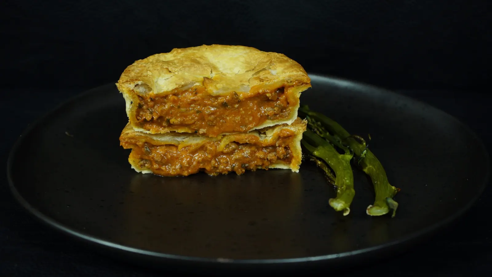 A Beefy Bolognese pie on a plate